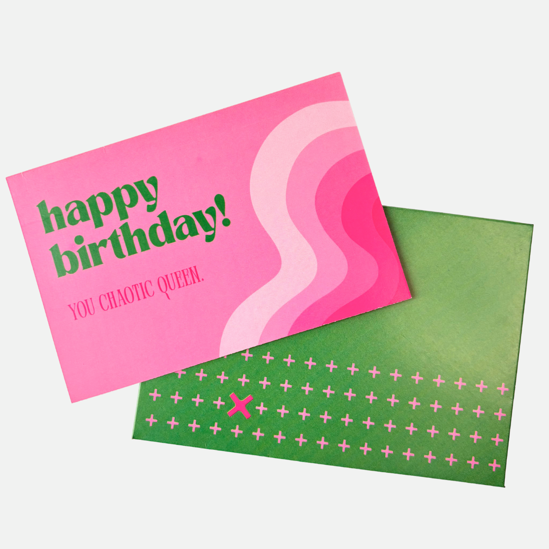 Pink birthday card with green text and a green envelope 