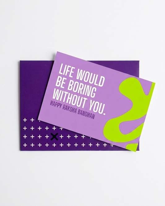 A purple greeting card with white text reading 'LIFE WOULD BE BORING WITHOUT YOU. HAPPY RAKSHA BANDHAN' and a bright lime green abstract shape, shown on top of a matching purple patterned card against a light gray background.